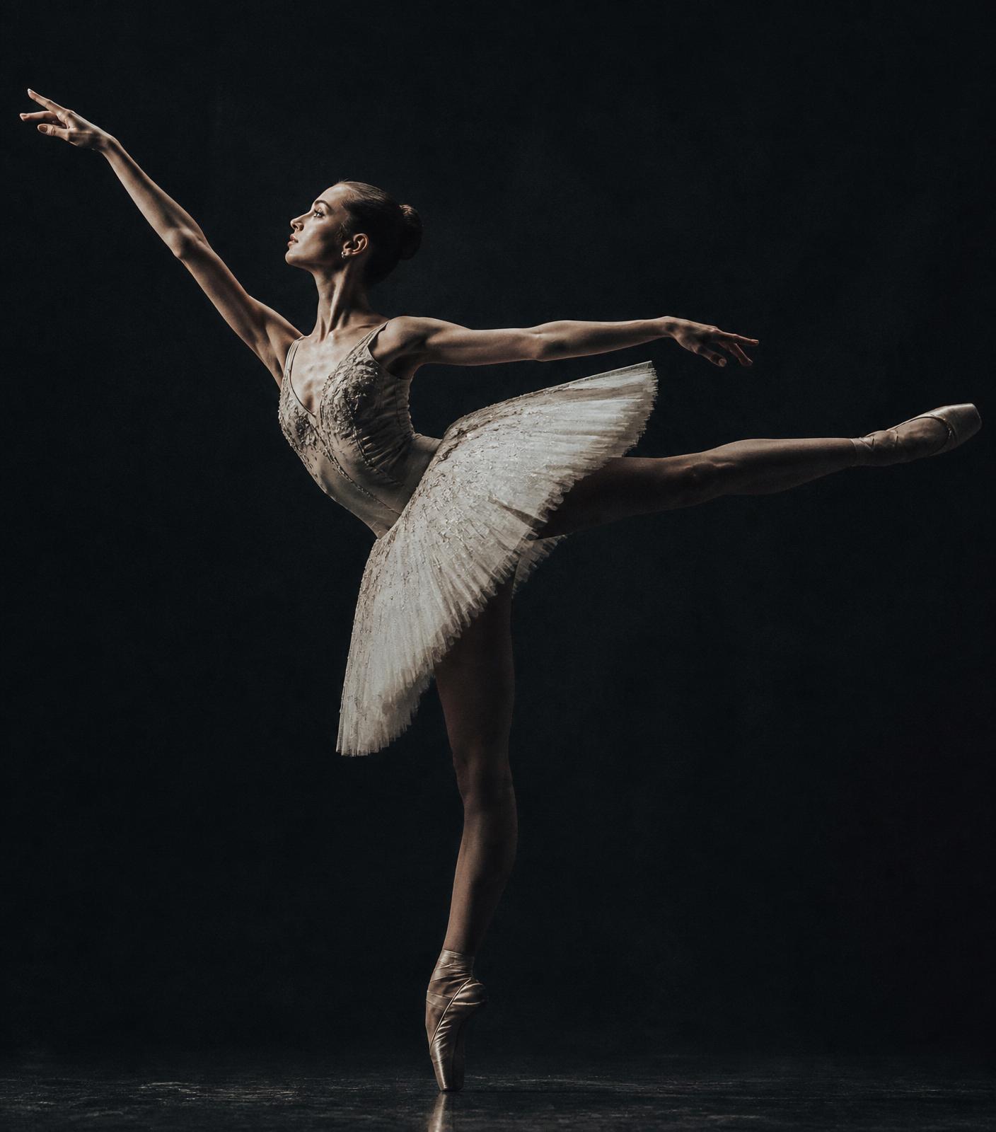 Ballet dancer en pointe under chiaroscuro lighting